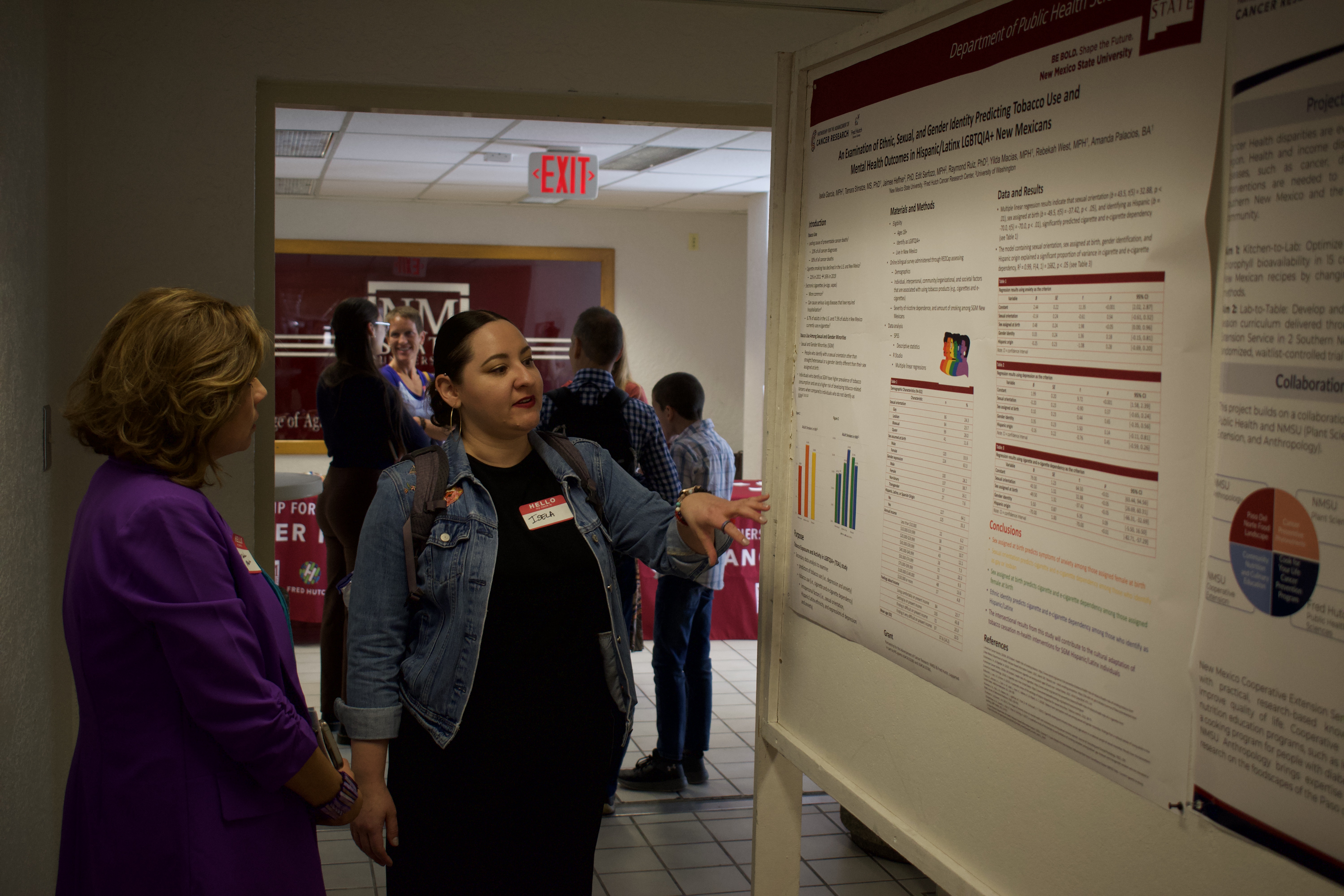 Image of people at a poster presentation 